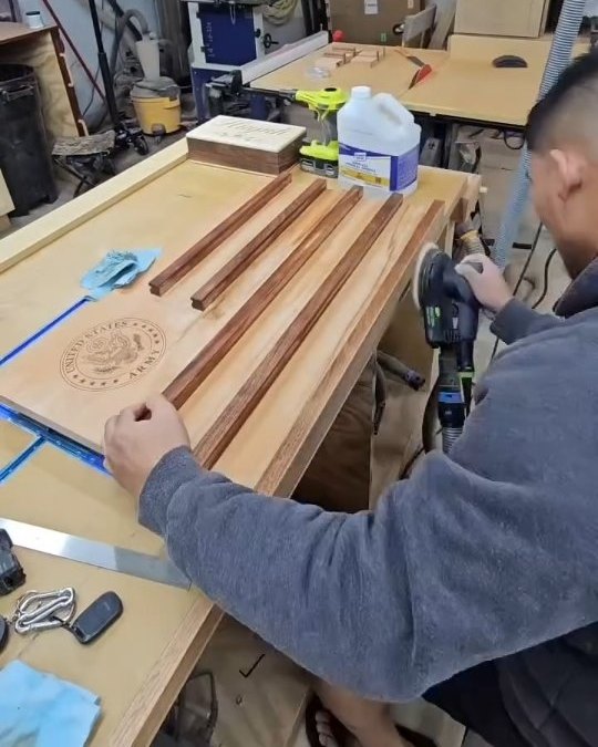Wooden Army challenge coin flag being built in the shop
